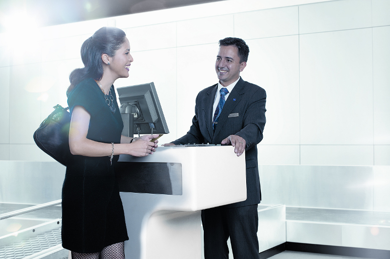 Woman checks in at Qantas counter