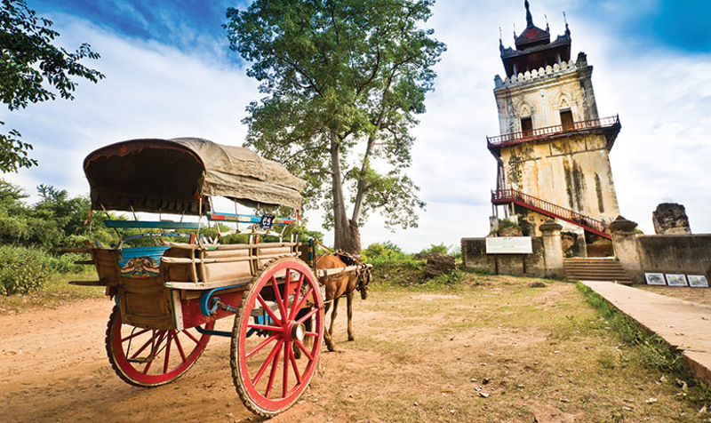 Horse drawn cart and historical tower Myanmar