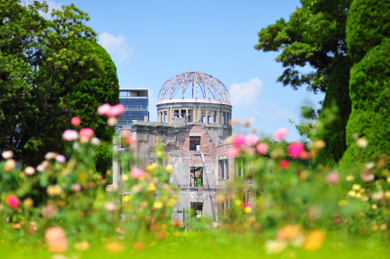 The ruins of the Genbaku Dome in Hiroshima, with flowers in foreground