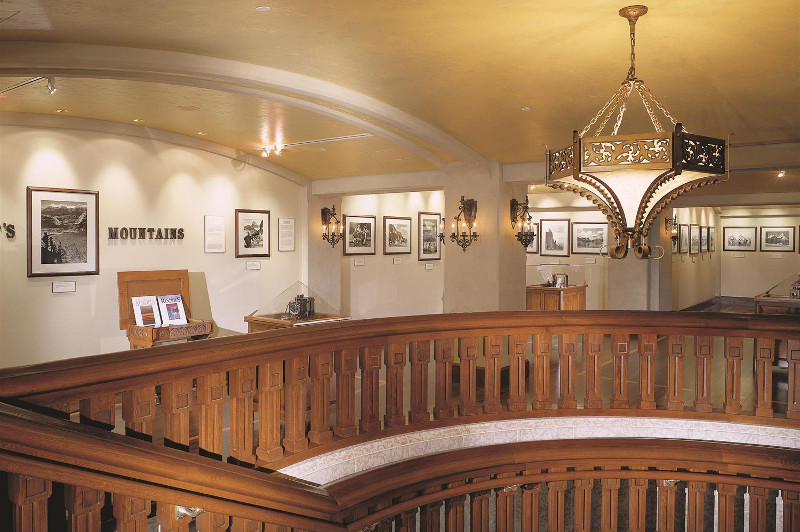 Hall way with photos and staircase in Banff Springs Hotel