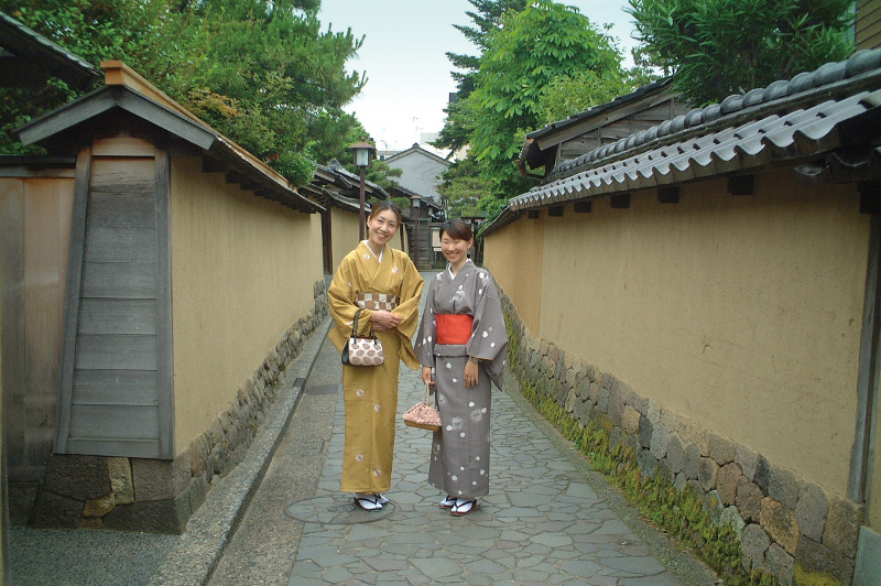 Young geisha walk along the streets of Higashi Chaya Geisha district