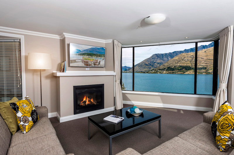 apartment interior with view of lake behind queenstown