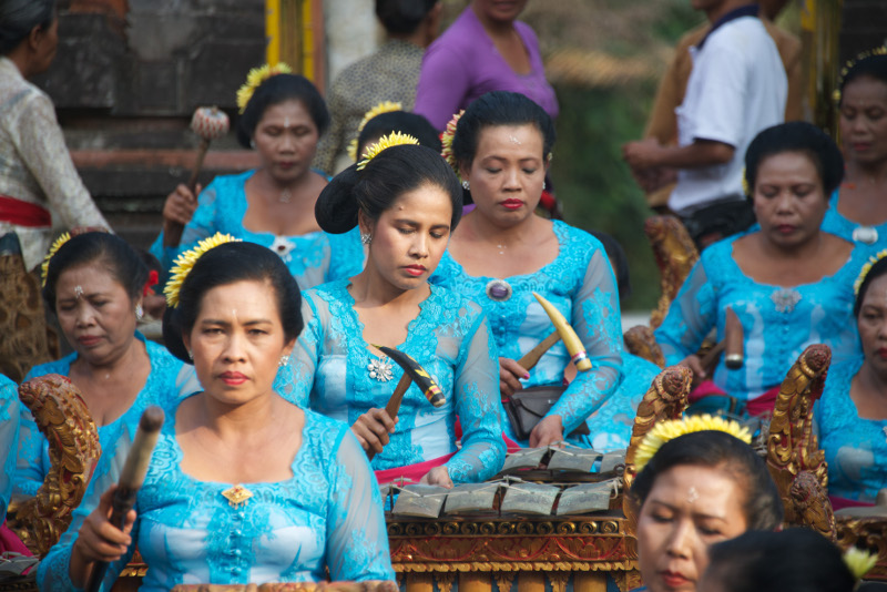 Ladies play traditional instruments at Balinese temple ceremony