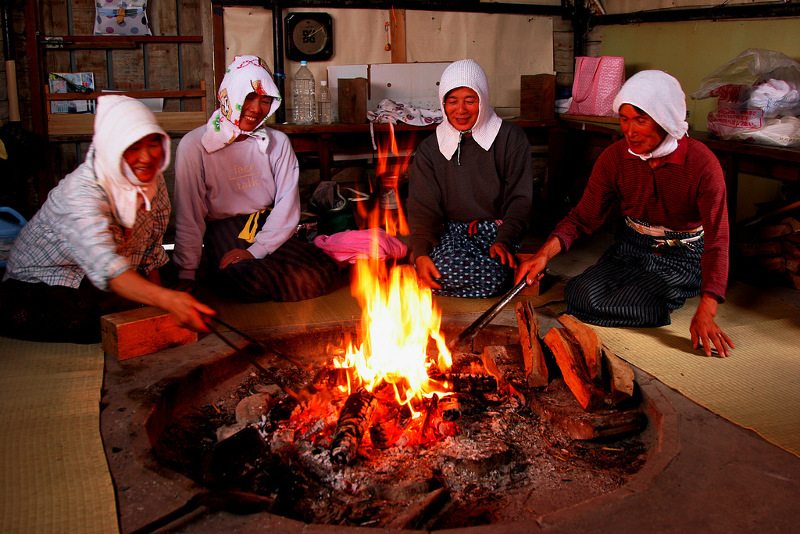 Japanese pearl divers around fire