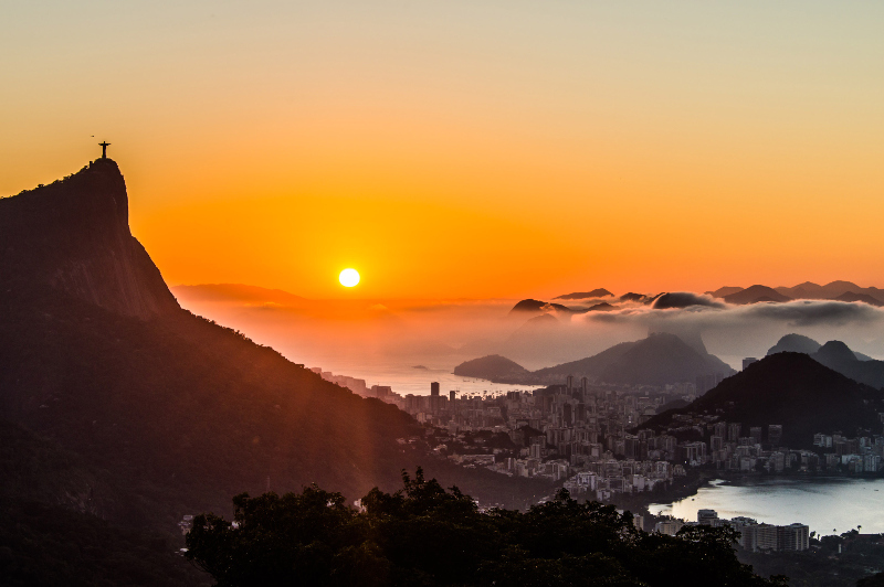 Rio's iconic Christ the Redeemer statue watches over the city at sunrise