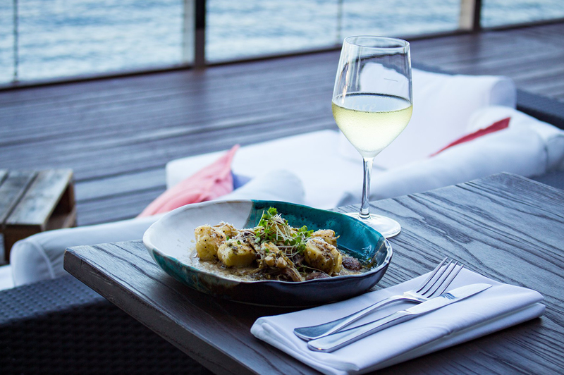 Ricotta gnocchi with wild mushrooms, truffle cream, salsa verde, pecorino at Ochre Restaurant