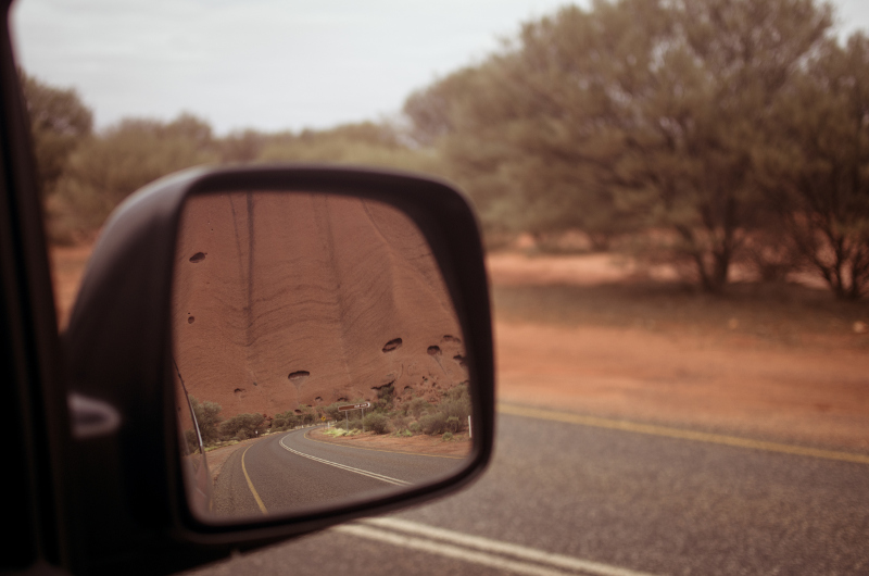 Uluru in car review mirror