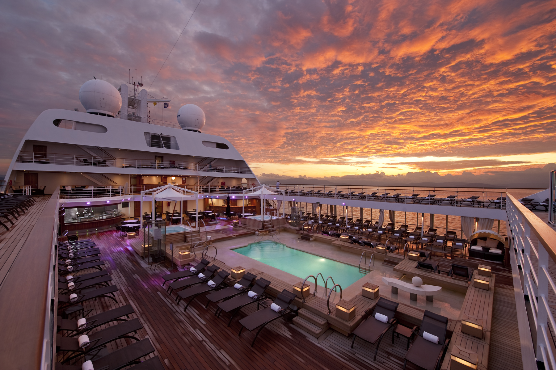 This image: The pool area found mid-ship on board Seabourn Odyssey. Source: Seabourn 