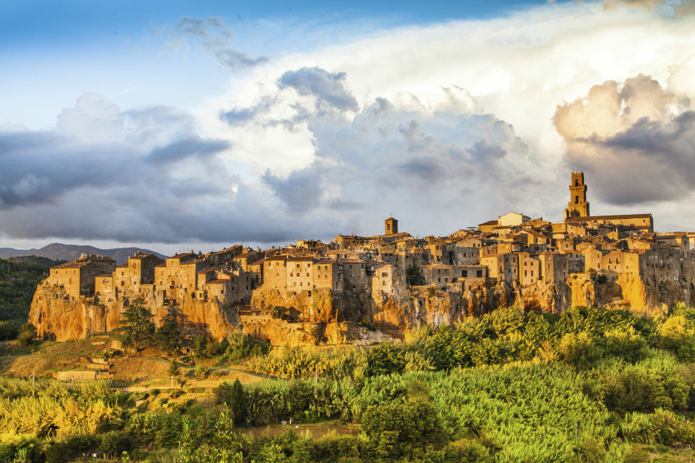 This image: Medieval town of Pitigliano at sunset, Tuscany.
