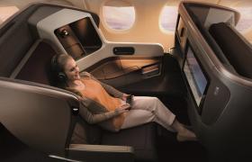 Image of lady enjoying Singapore Airlines Business Class